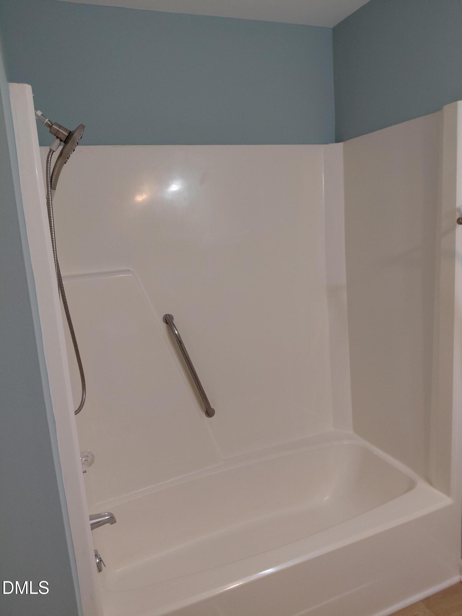 804 Olive Street Apex, NC 27502 - Photo 35 of 60 a bathroom with a bathtub