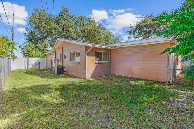a backyard of a house with seating space