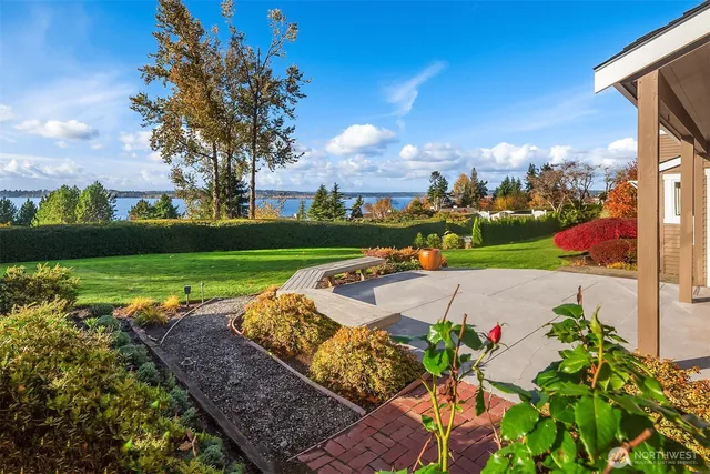 a view of a yard with an outdoor seating
