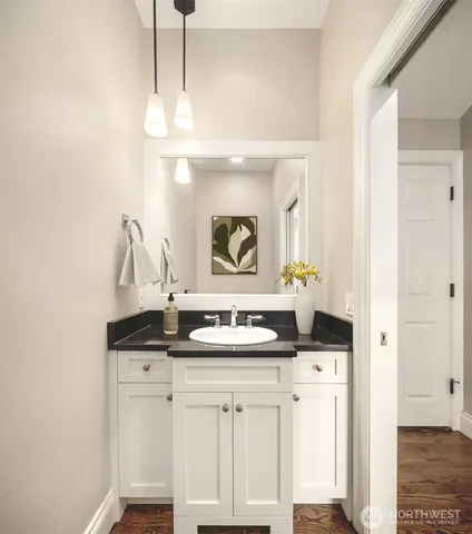 a bathroom with a sink and a mirror