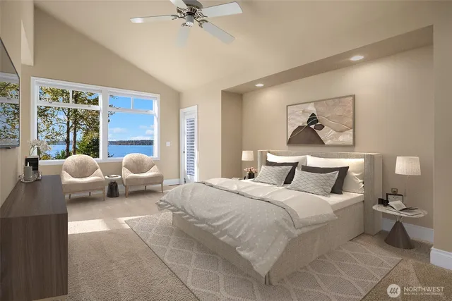 a bedroom with a bed and view of living room