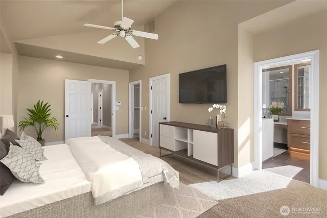 a bedroom with a bed and a flat screen tv