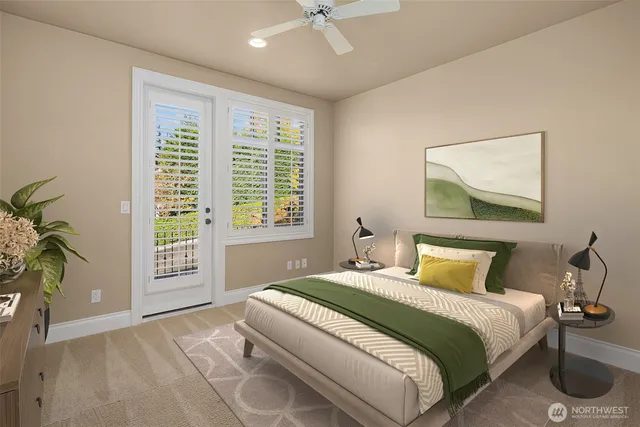 a bedroom with a bed and a potted plant