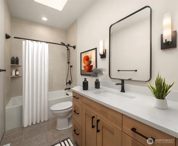 a bathroom with a toilet a sink and a mirror