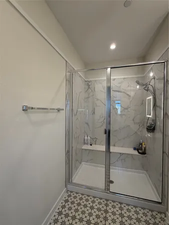 a bathroom with a shower and toilet