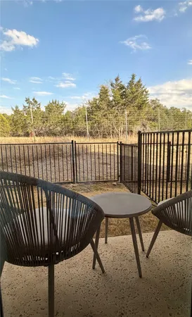 a view of a roof deck with wooden floor and fence