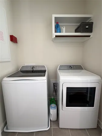a utility room with washer and dryer