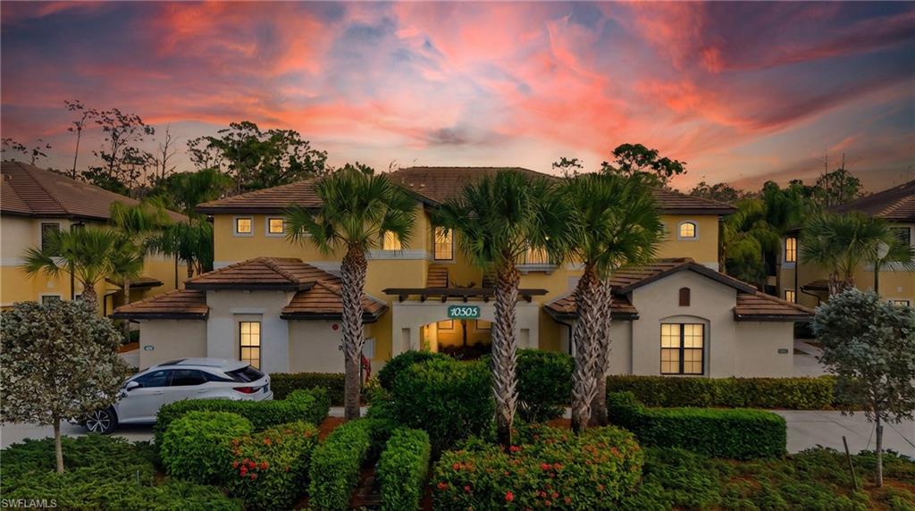 10505 Casella Way, Unit 202 Fort Myers, FL 33913 - Photo 1 of 50 a front view of a house with a garden