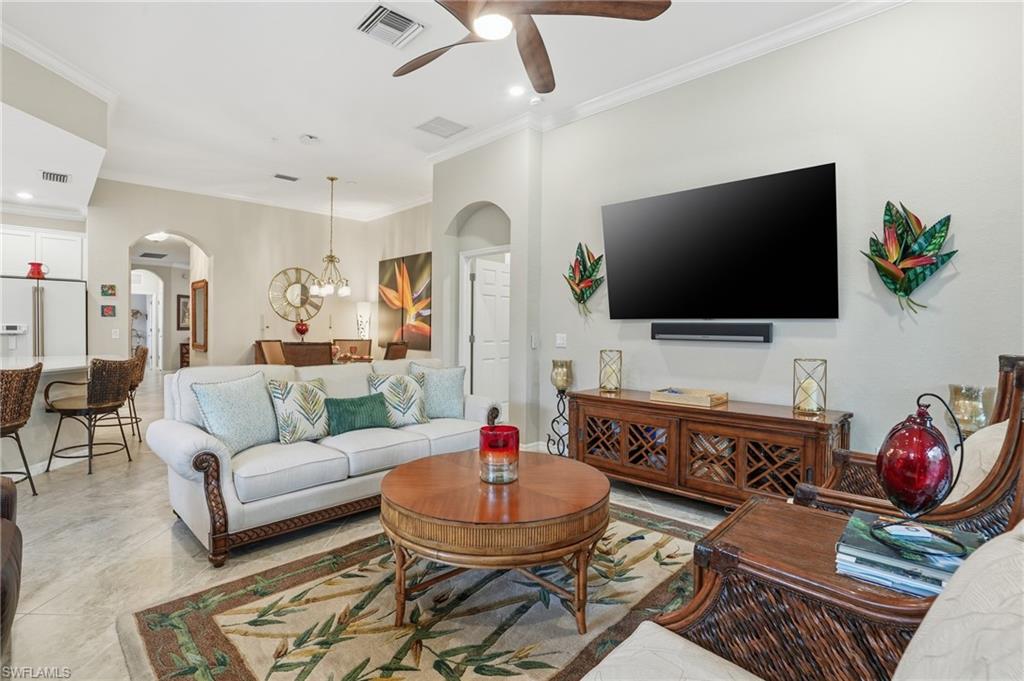 10505 Casella Way, Unit 202 Fort Myers, FL 33913 - Photo 19 of 50 a living room with furniture and a flat screen tv
