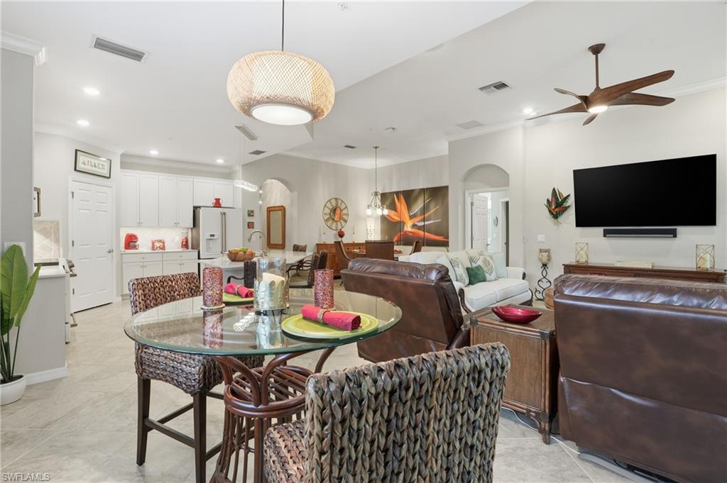 10505 Casella Way, Unit 202 Fort Myers, FL 33913 - Photo 22 of 50 a view of a dining room with furniture
