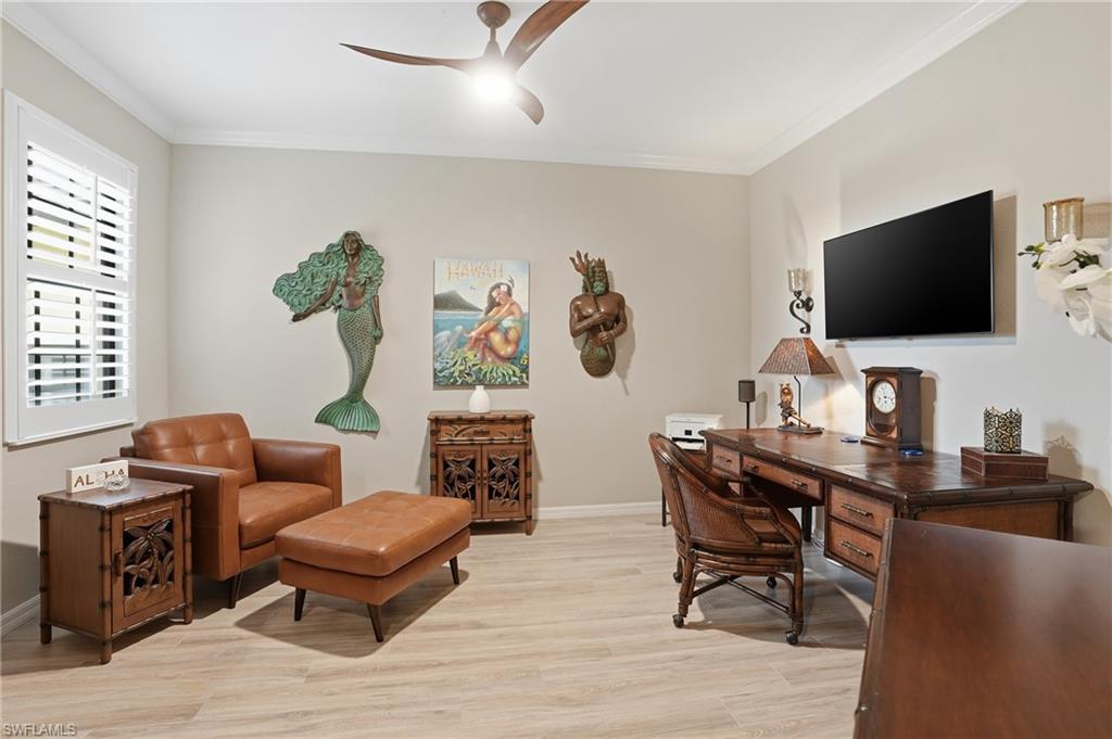 10505 Casella Way, Unit 202 Fort Myers, FL 33913 - Photo 30 of 50 a living room with furniture and a flat screen tv