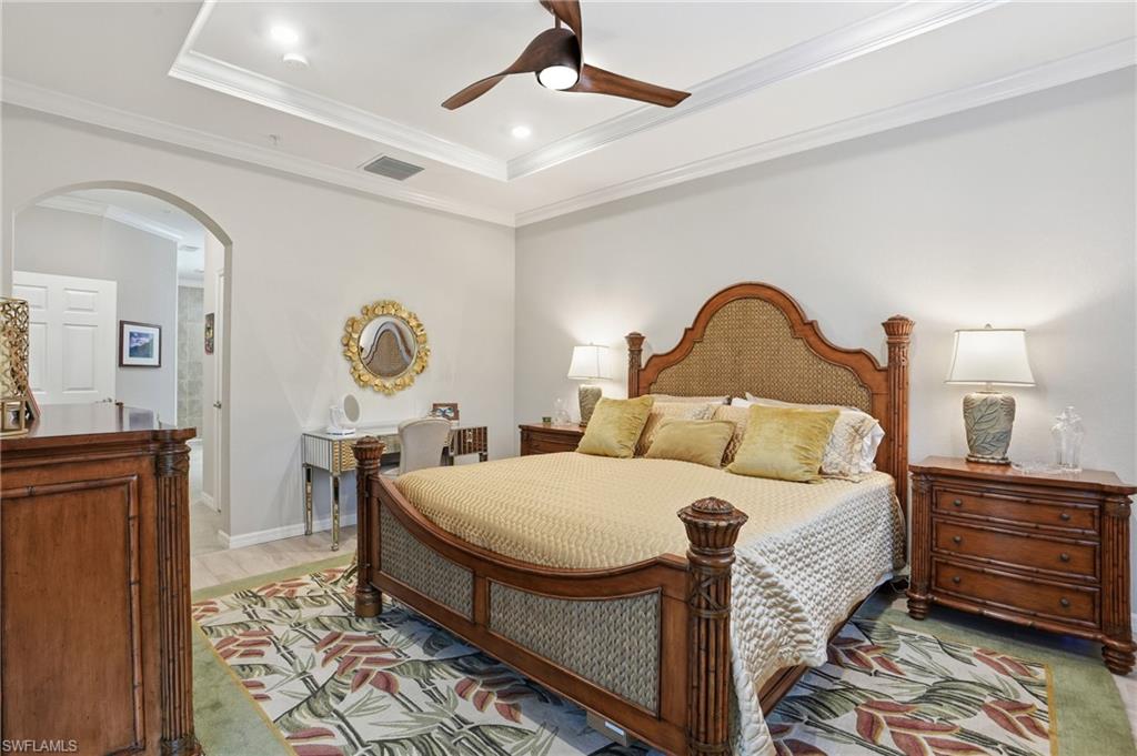 10505 Casella Way, Unit 202 Fort Myers, FL 33913 - Photo 34 of 50 a bedroom with a bed and dresser with mirror