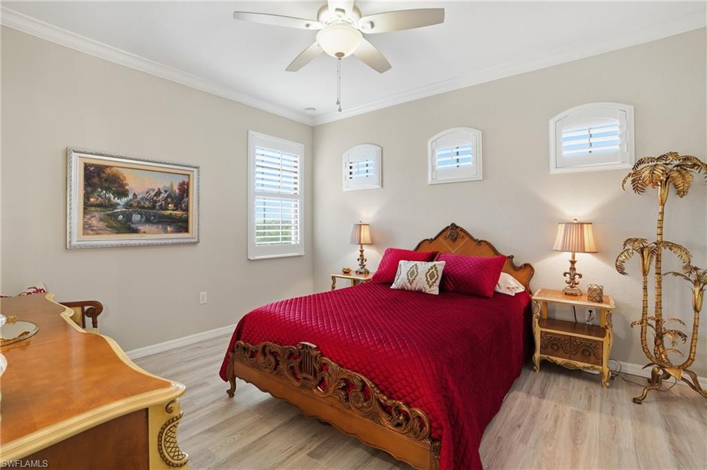 10505 Casella Way, Unit 202 Fort Myers, FL 33913 - Photo 36 of 50 a bedroom with a bed and a dresser