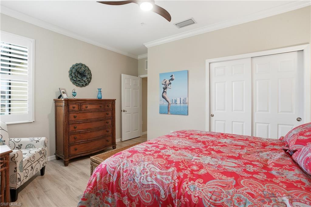 10505 Casella Way, Unit 202 Fort Myers, FL 33913 - Photo 39 of 50 a bedroom with a bed and a window