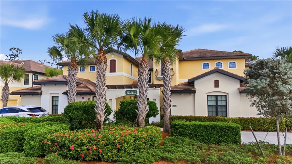 10505 Casella Way, Unit 202 Fort Myers, FL 33913 - Photo 4 of 50 a front view of a house with a garden