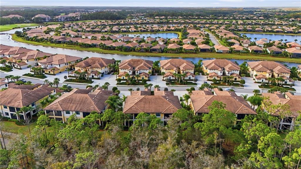 10505 Casella Way, Unit 202 Fort Myers, FL 33913 - Photo 46 of 50 an aerial view of lake residential houses with outdoor space and seating