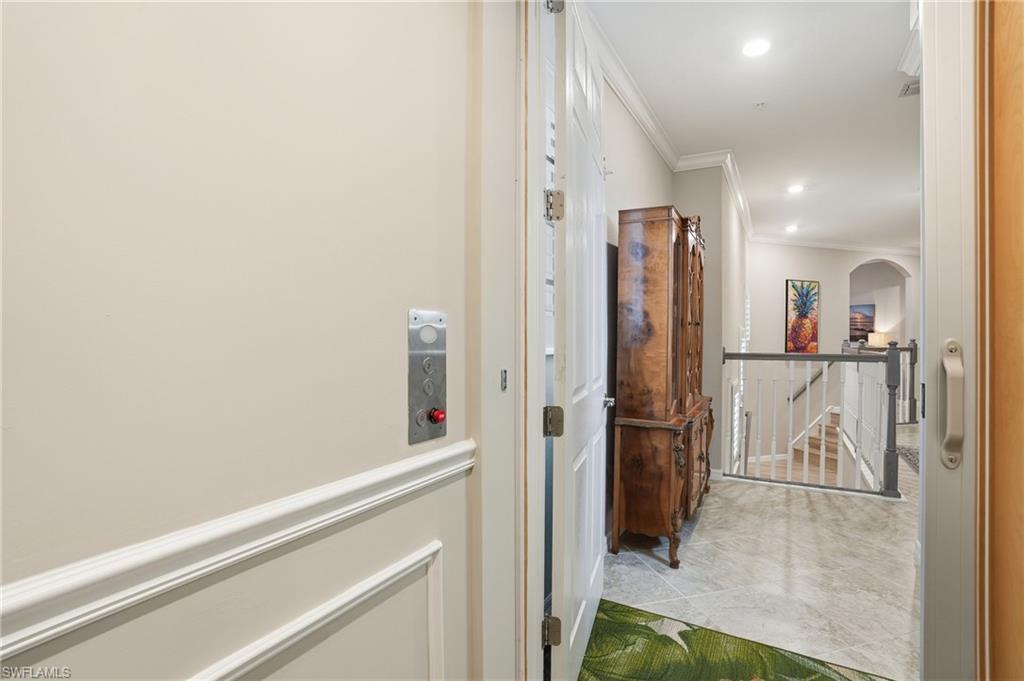10505 Casella Way, Unit 202 Fort Myers, FL 33913 - Photo 10 of 50 a view of a hallway with wooden floor and staircase