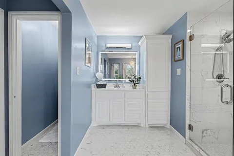 a view of a bathroom from the hallway