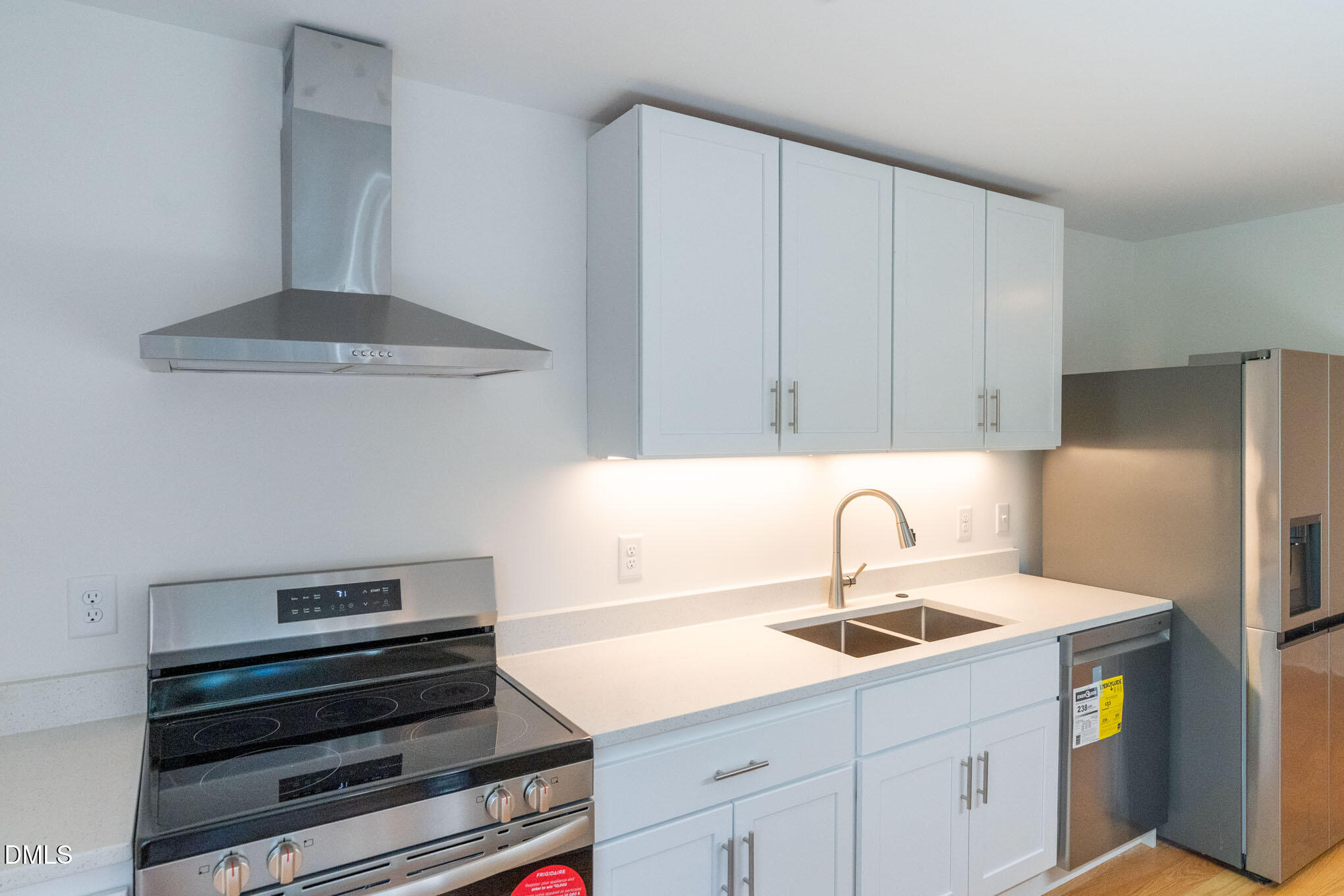 402 East Martin Street Raleigh, NC 27601 - Photo 5 of 23 a kitchen with a sink and cabinets