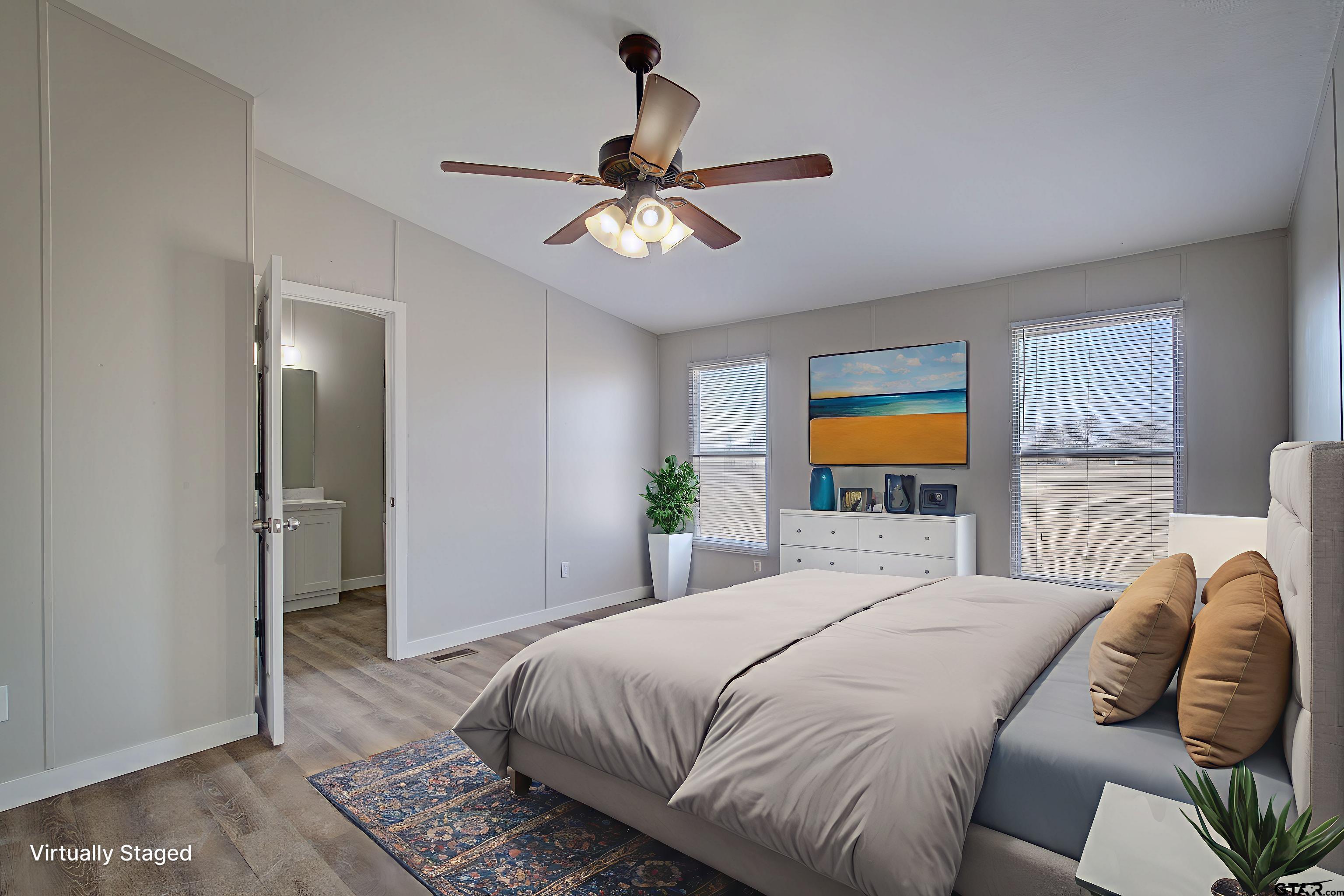 1945 Co Road Sulphur Springs, TX 75482 - Photo 12 of 29 a bedroom with a bed and a chandelier