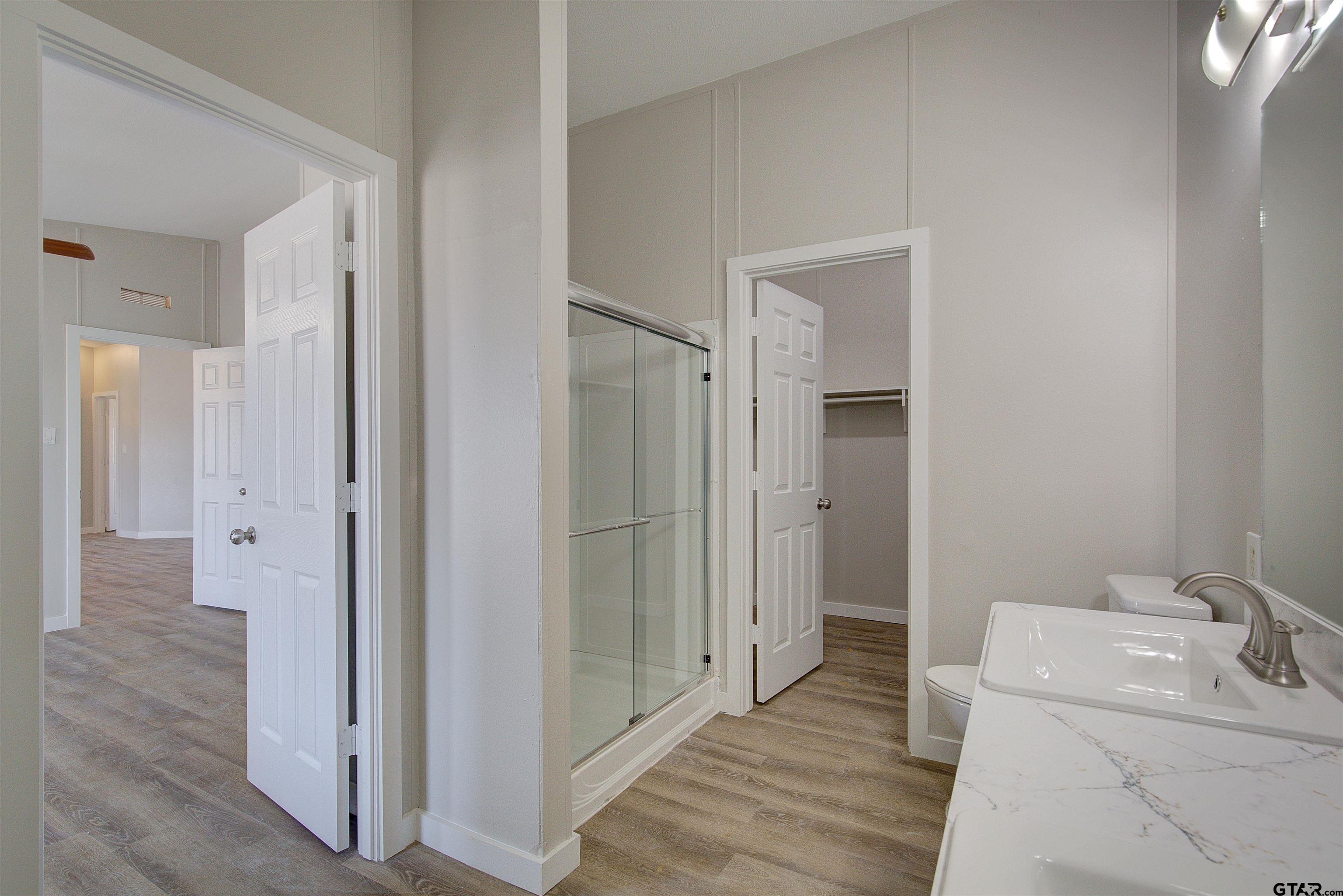 1945 Co Road Sulphur Springs, TX 75482 - Photo 15 of 29 a bathroom with a sink and a mirror