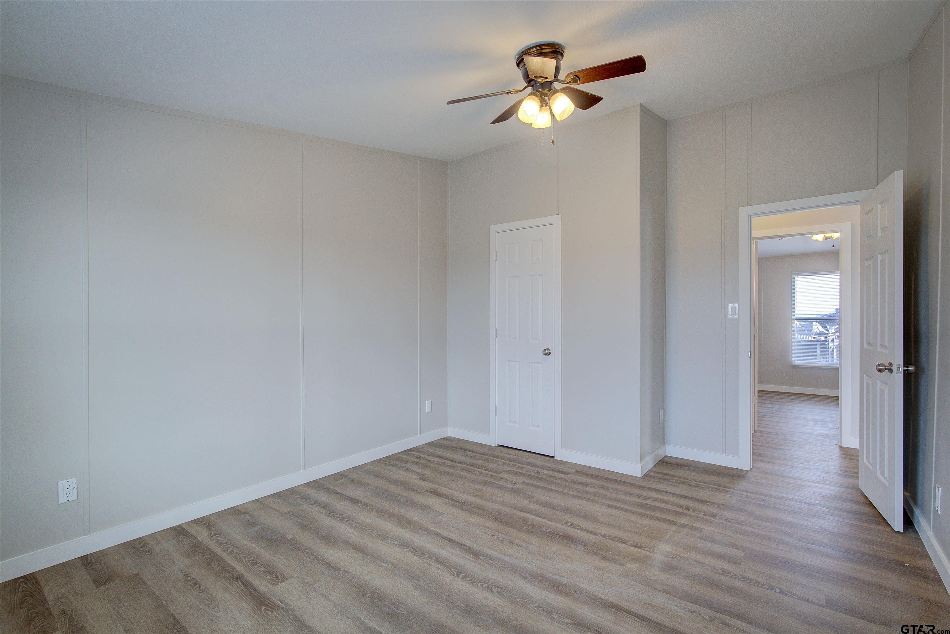1945 Co Road Sulphur Springs, TX 75482 - Photo 18 of 29 wooden floor in an empty room with a window