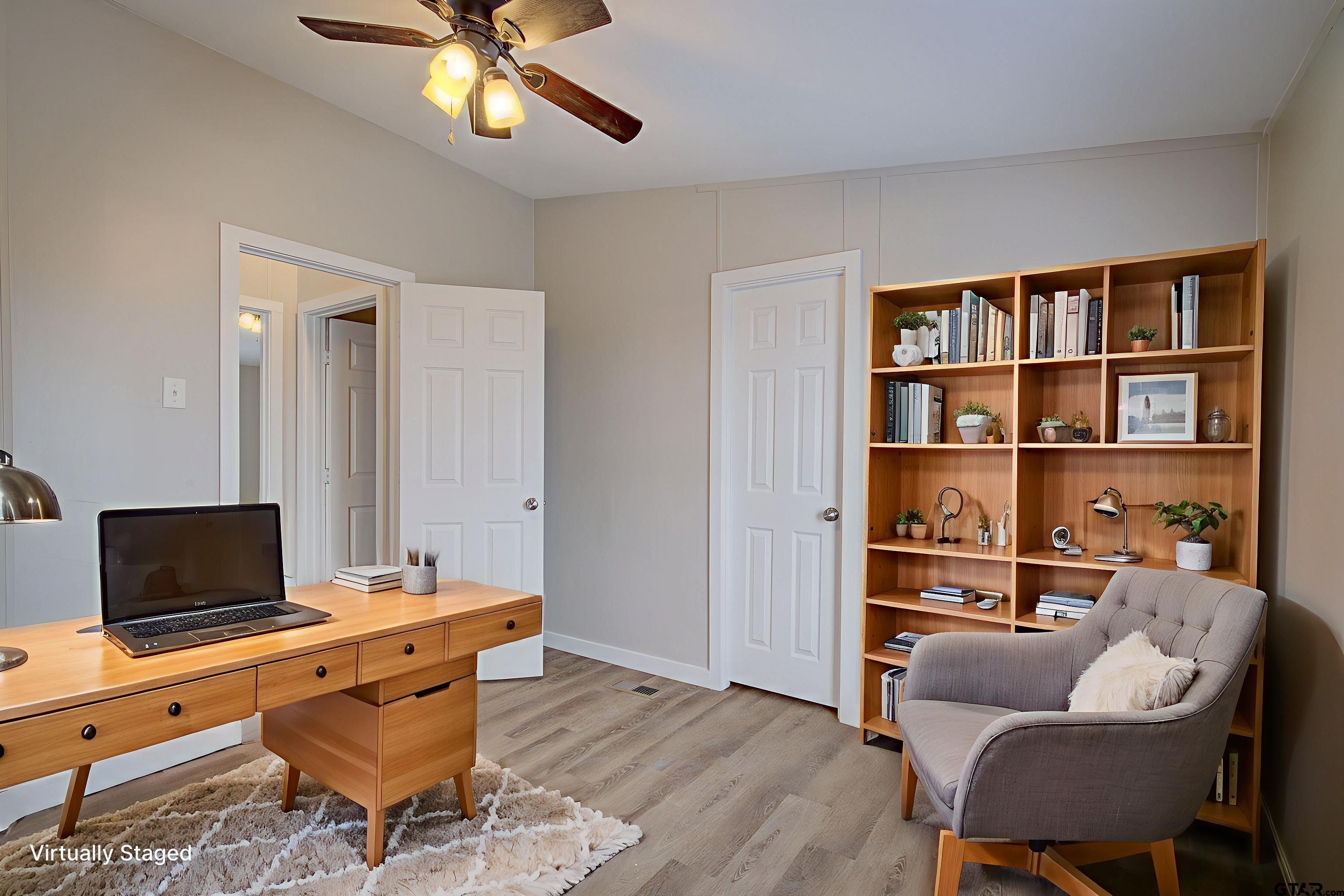 1945 Co Road Sulphur Springs, TX 75482 - Photo 23 of 29 a living room with furniture a rug and a flat screen tv