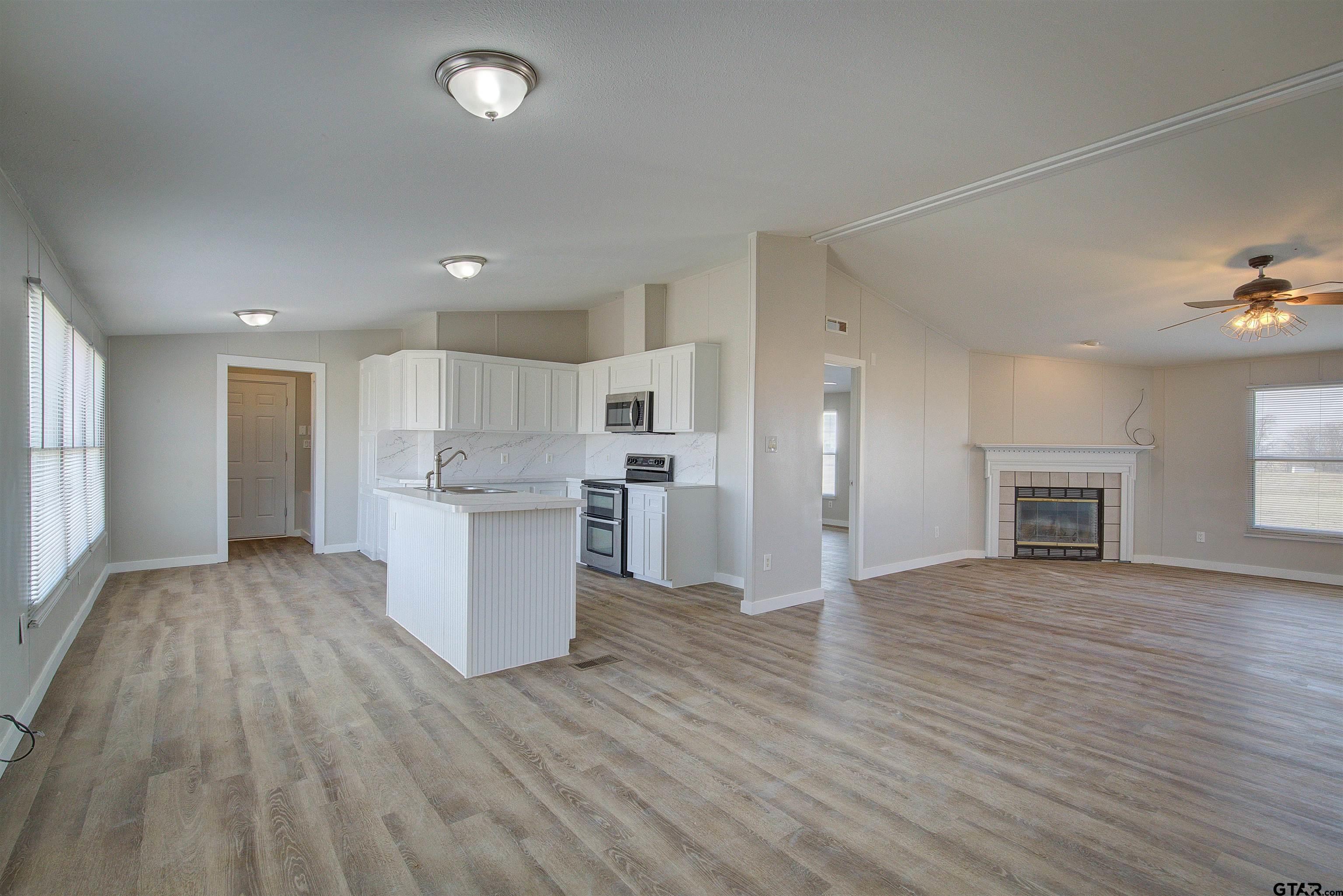 1945 Co Road Sulphur Springs, TX 75482 - Photo 7 of 29 a view of kitchen with wooden floor and electronic appliances