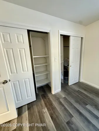 a view of front door with wooden floor