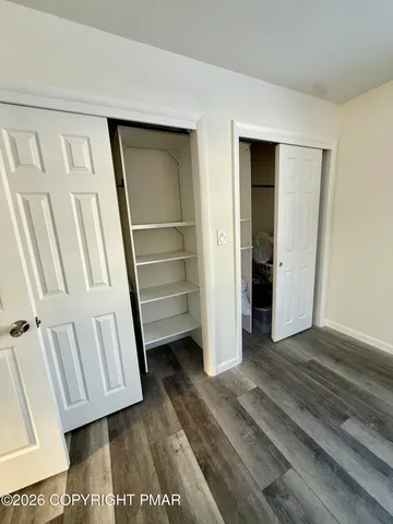 a view of front door with wooden floor