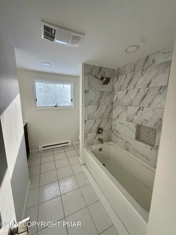 a bathroom with a bathtub