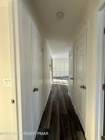 a view of a bathroom from the hallway