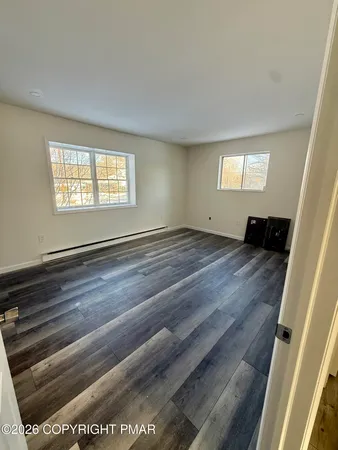 a view of an empty room and window