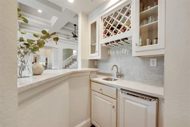a bathroom with a sink a mirror and a shower