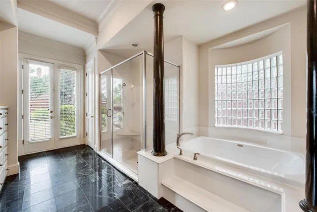 a bathroom with a glass shower door