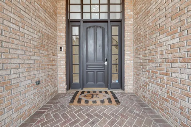 a view of a wooden door of the house