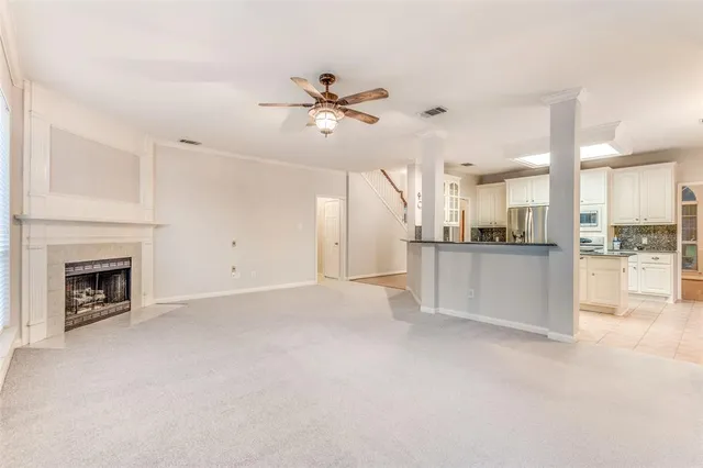 a bathroom with a granite countertop sink two mirror and a shower