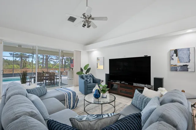 a kitchen with a sink and white cabinets