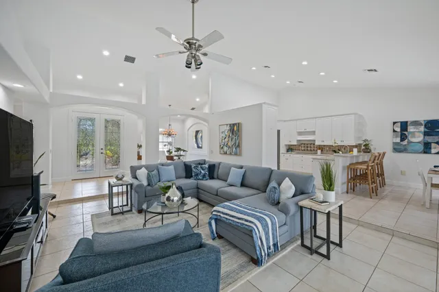 a kitchen with white cabinets and a sink