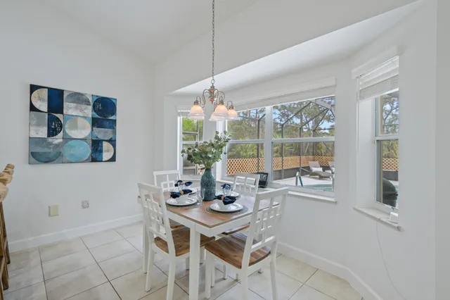 a kitchen with cabinets and steel appliances