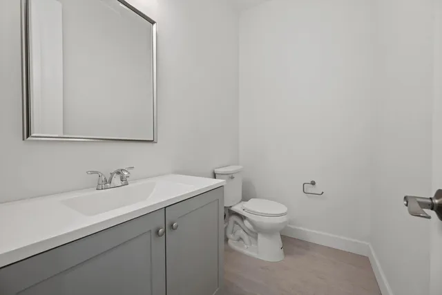 a view of a dining room with furniture wooden floor and a chandelier