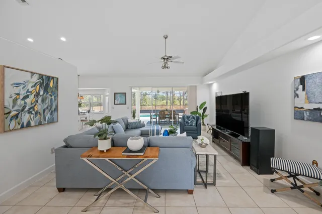 a view of a dining room with furniture and chandelier