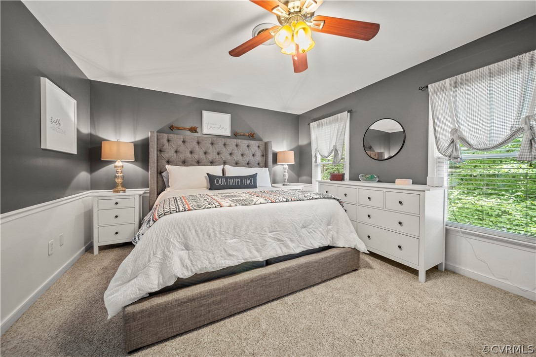 10806 Ridgerun Road Chesterfield, VA 23832 - Photo 26 of 48 a bed room with a bed a mirror and a large window