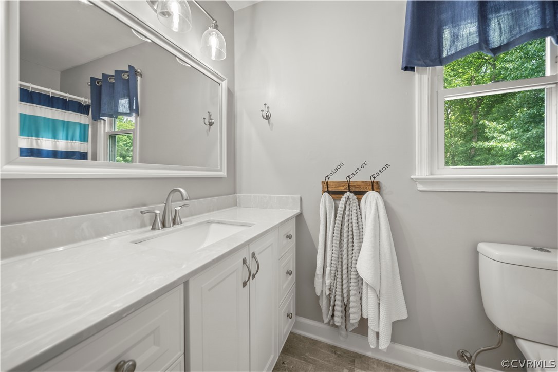 10806 Ridgerun Road Chesterfield, VA 23832 - Photo 32 of 48 a bathroom with a sink a toilet and a window