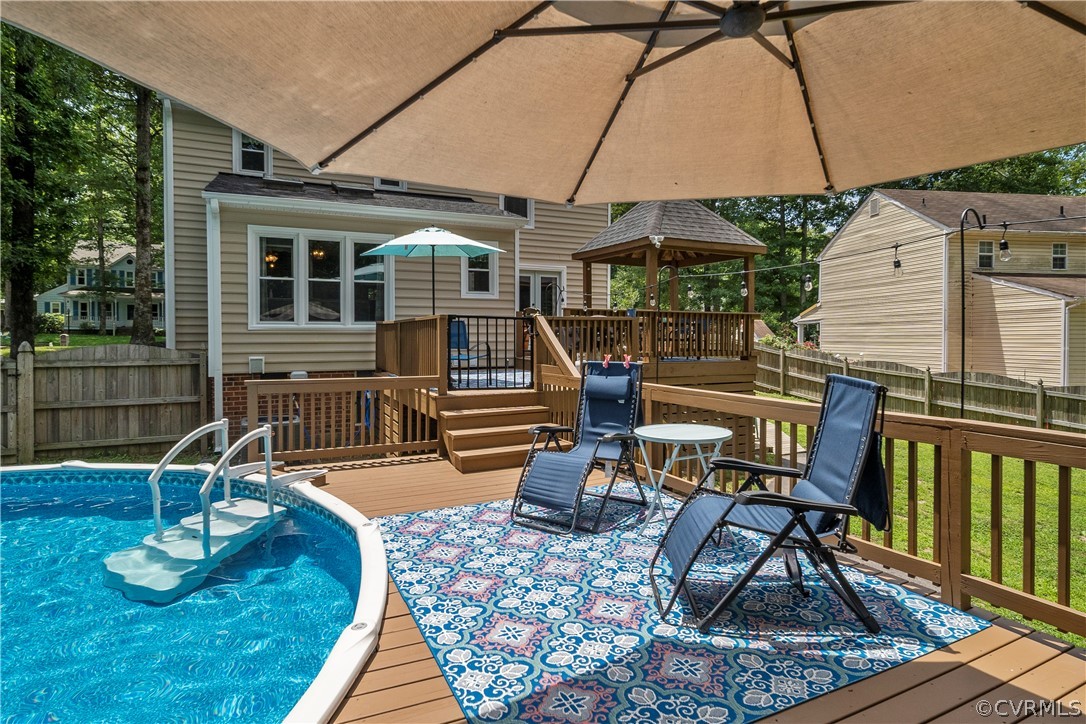 10806 Ridgerun Road Chesterfield, VA 23832 - Photo 36 of 48 a view of a house with backyard sitting area and furniture