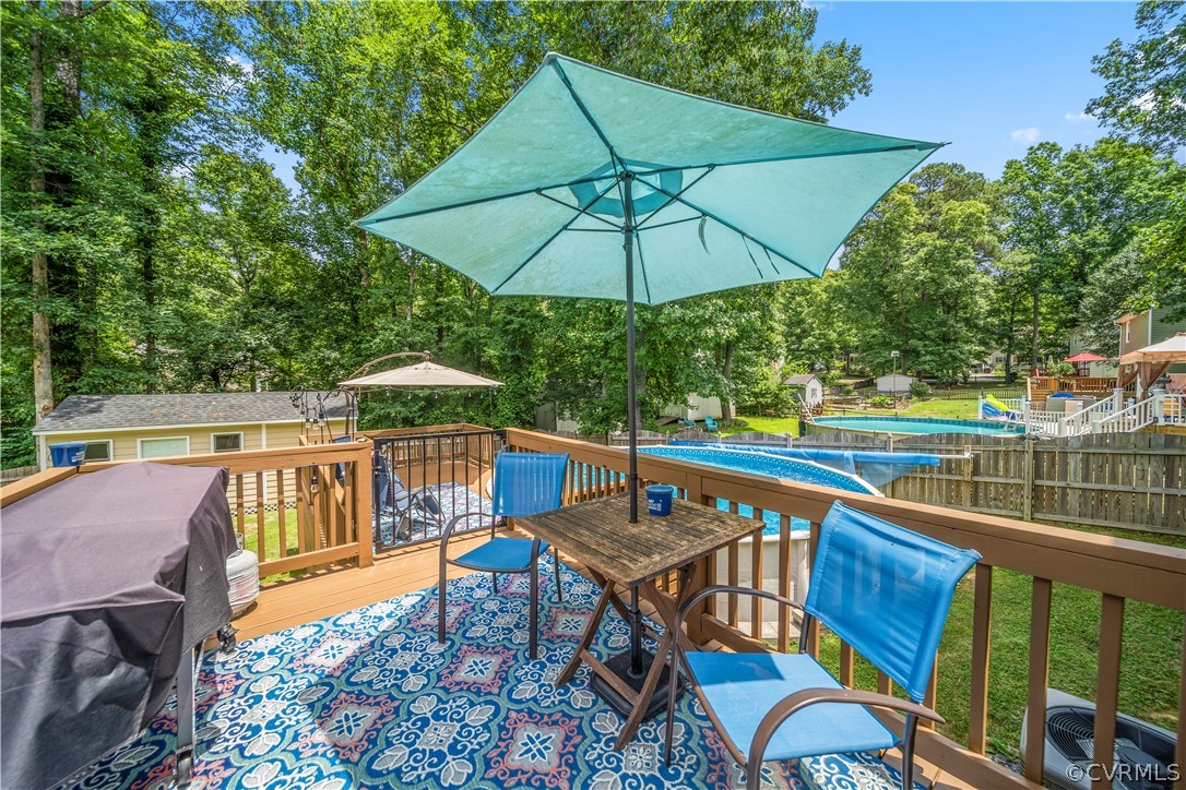 10806 Ridgerun Road Chesterfield, VA 23832 - Photo 41 of 48 a view of a balcony with wooden floor and outdoor seating