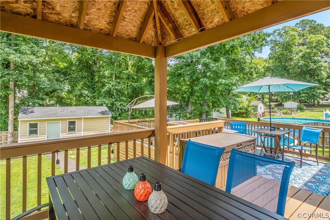 10806 Ridgerun Road Chesterfield, VA 23832 - Photo 42 of 48 a view of a patio with wooden floor chairs