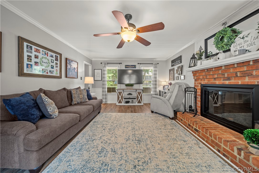 10806 Ridgerun Road Chesterfield, VA 23832 - Photo 7 of 48 a living room with furniture a fireplace and a ceiling fan