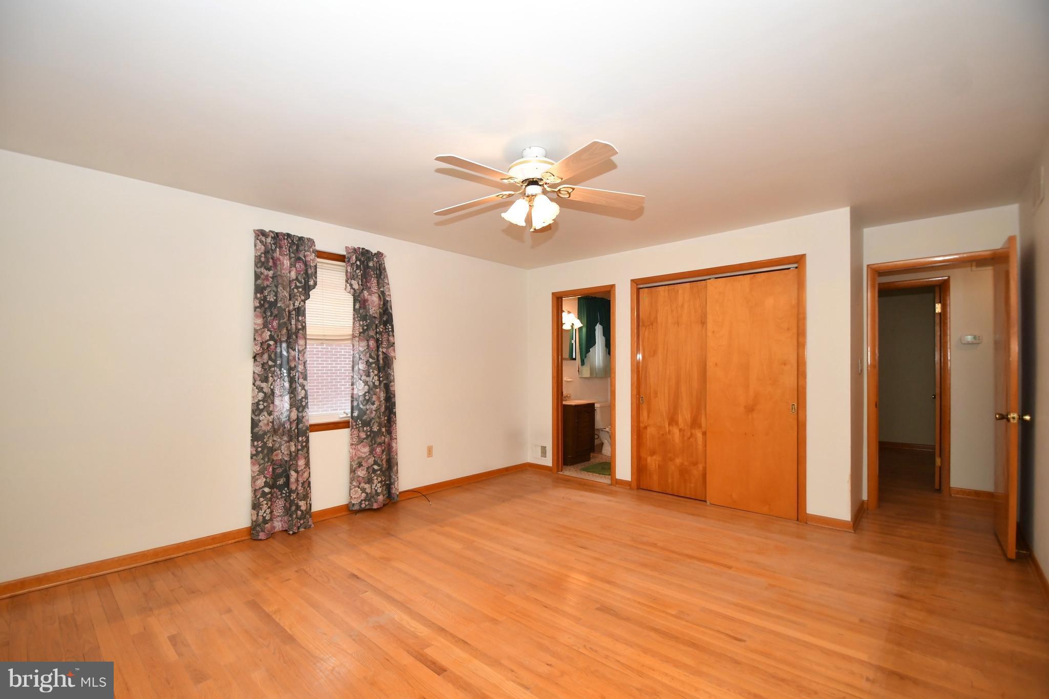 9412 Dawnvale Road Baltimore, MD 21236 - Photo 13 of 28 an empty room with closet and a ceiling fan