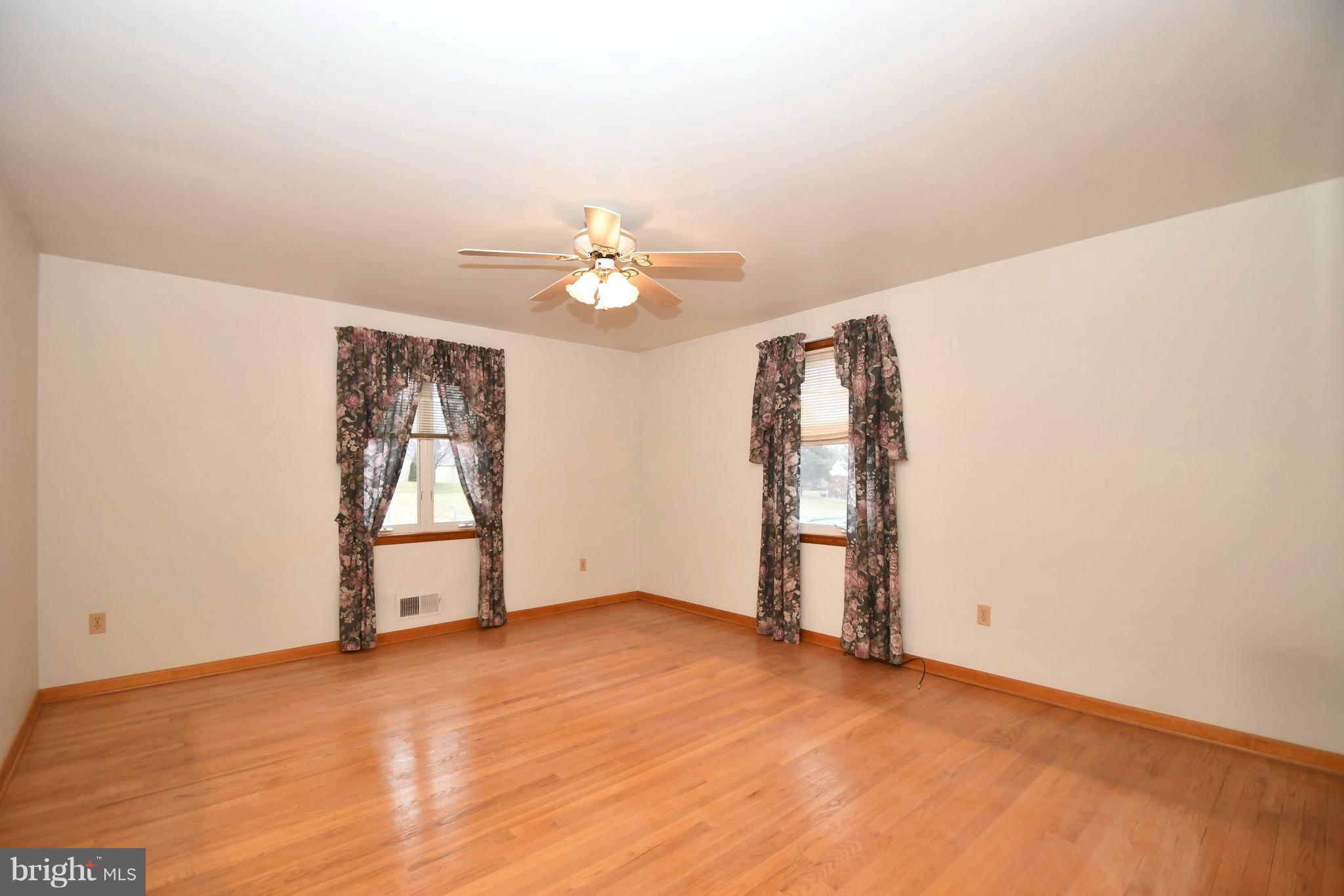 9412 Dawnvale Road Baltimore, MD 21236 - Photo 14 of 28 an empty room with windows and closet